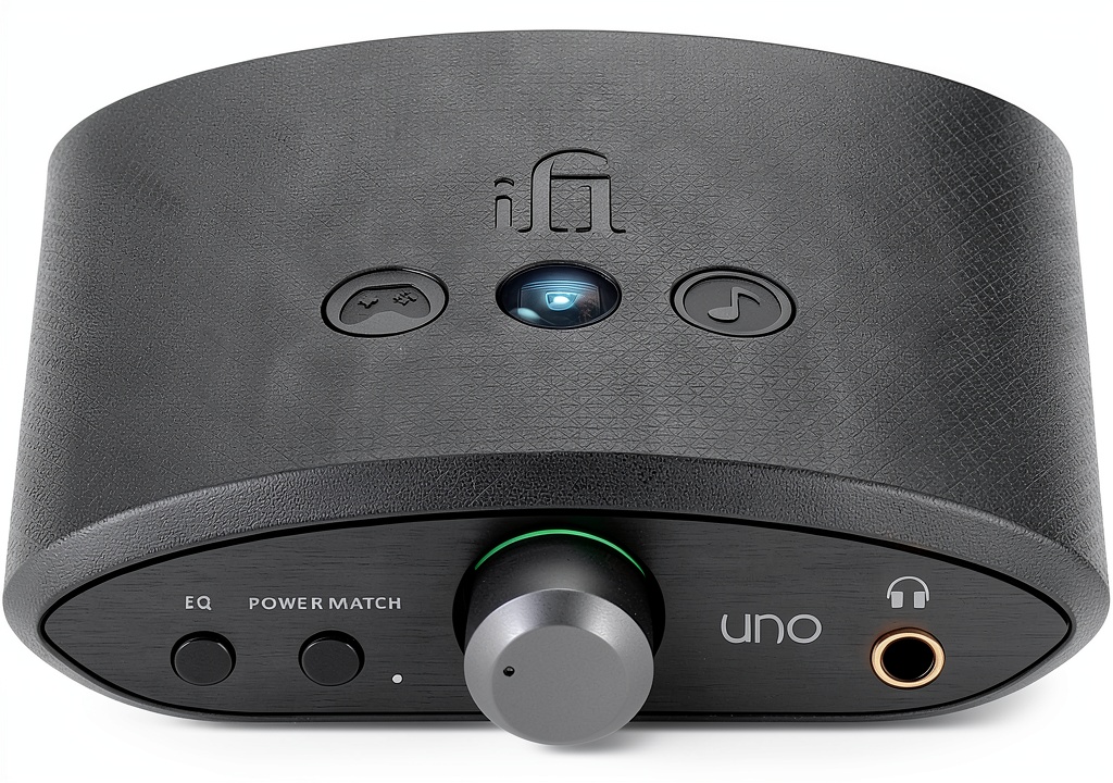 Headphone amplifier connected to a smartphone on a coffee table